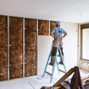 Worker-installing-drywall-hero